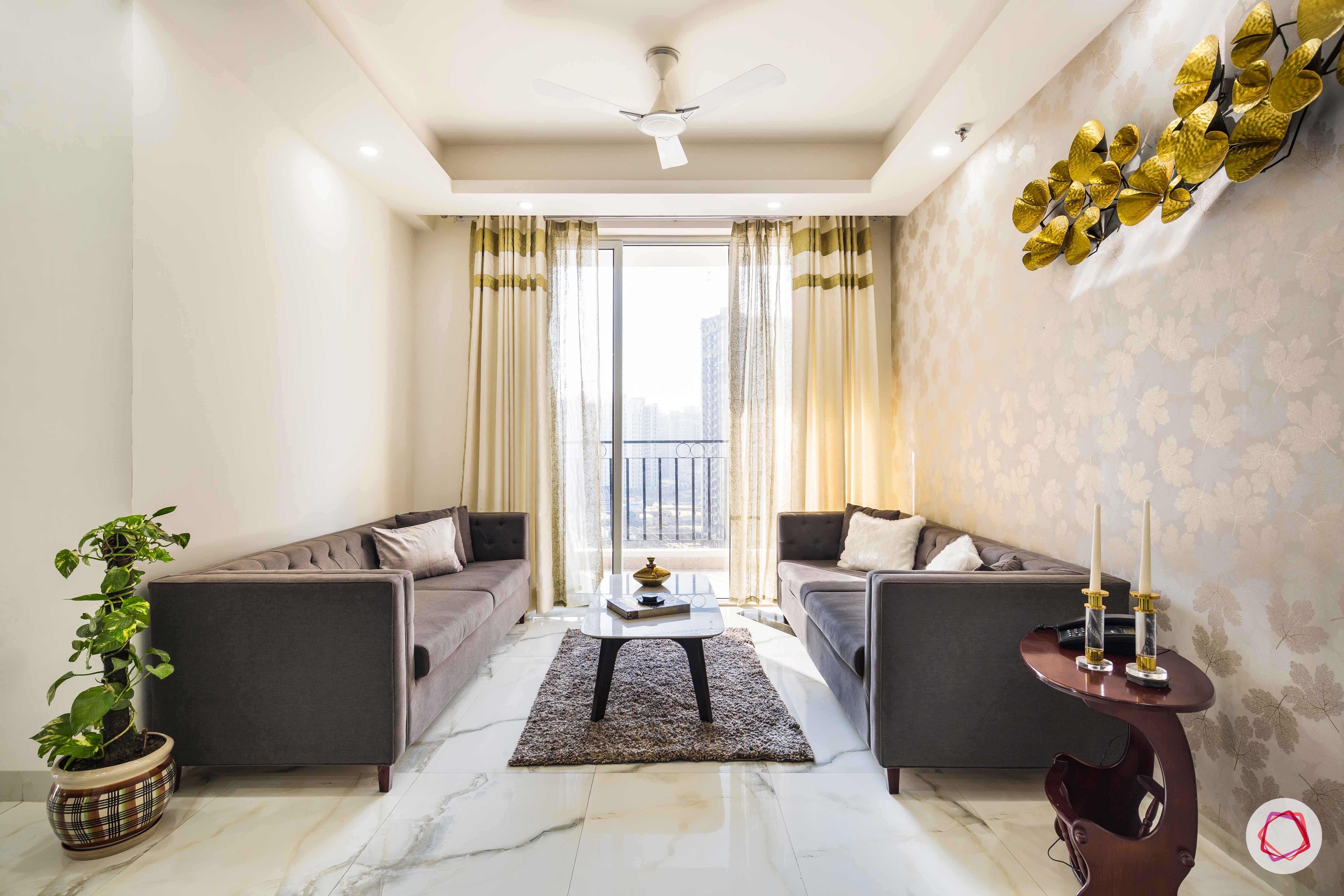 Nirala-Aspire-living-room-grey-sofas-gold-accent-coffee-table