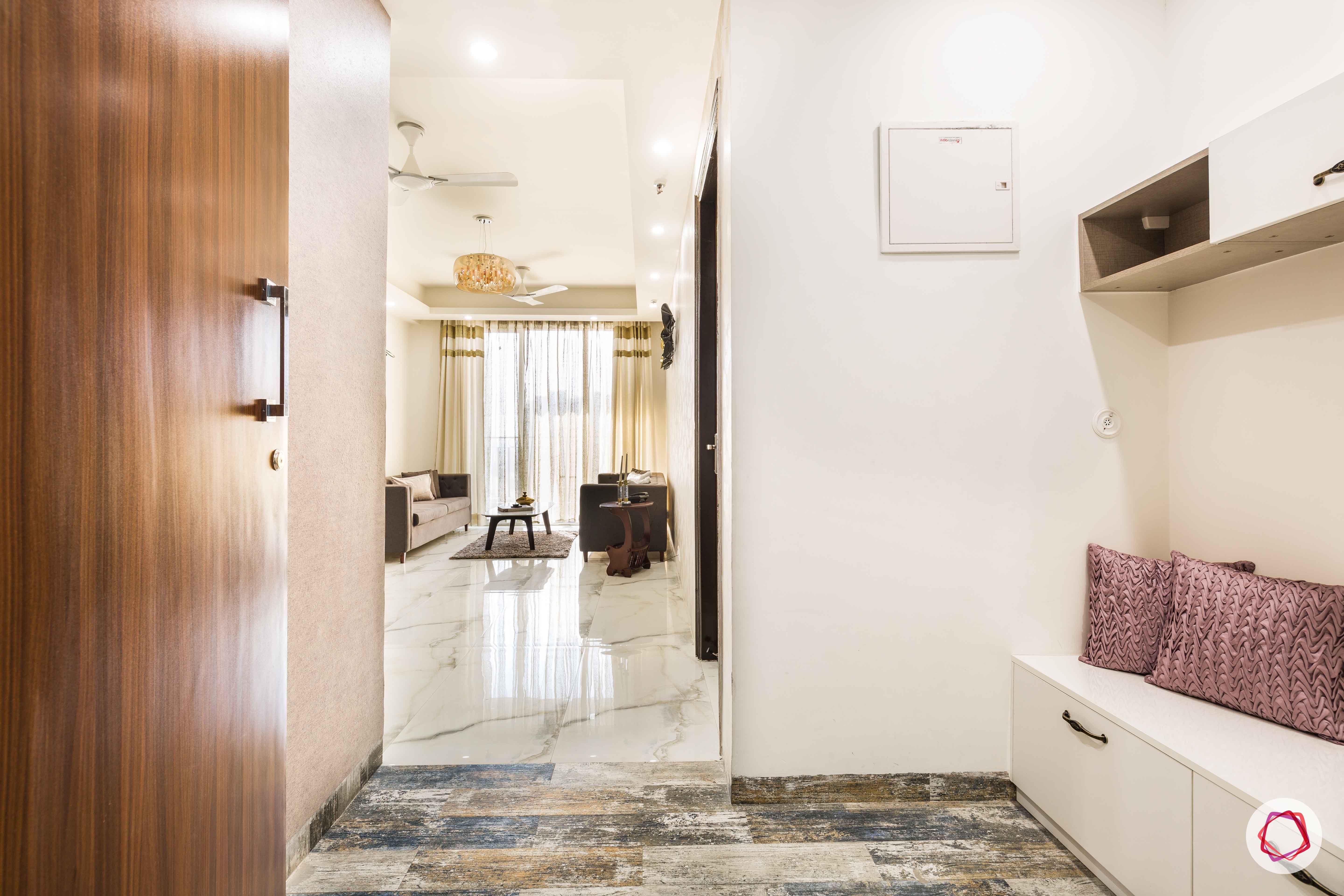 Nirala-Aspire-foyer-shoe-cabinet-white-door-colourful-tiles-floor