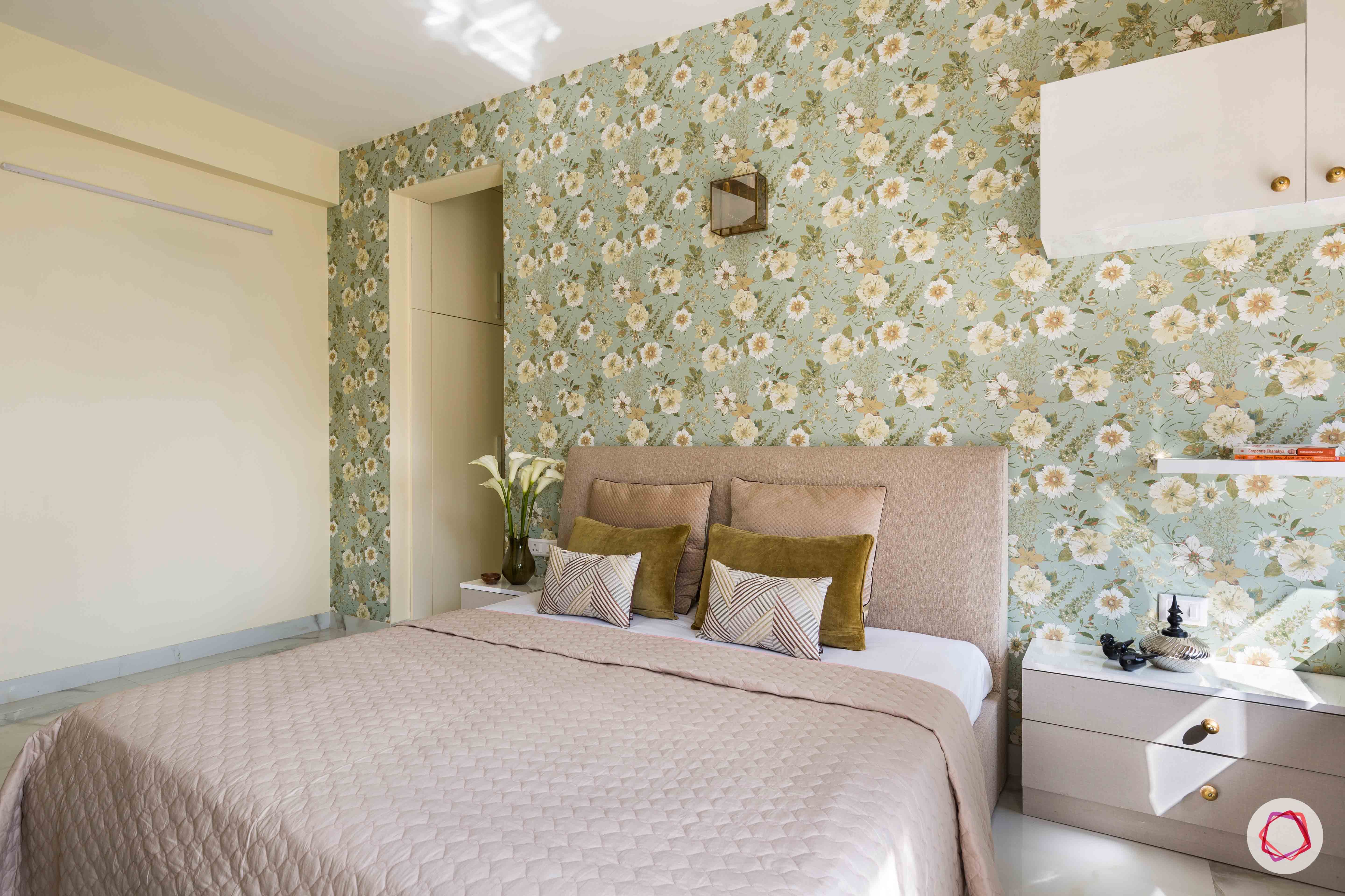 master-bedroom-floral-wallpaper-headboard-pillows-bed-sidetable