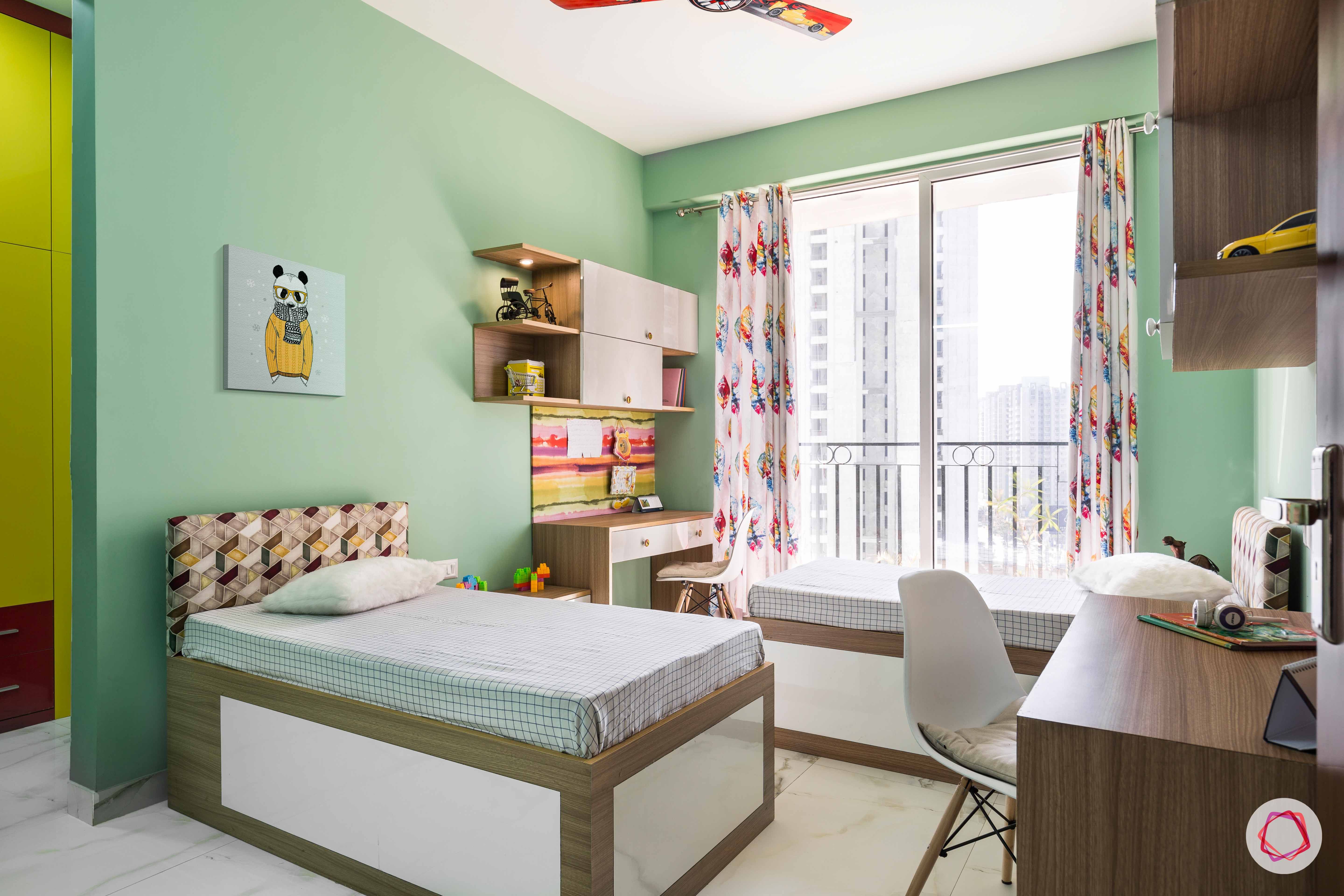 kids-bedroom-mint-green-paint-walls-study-table-beds
