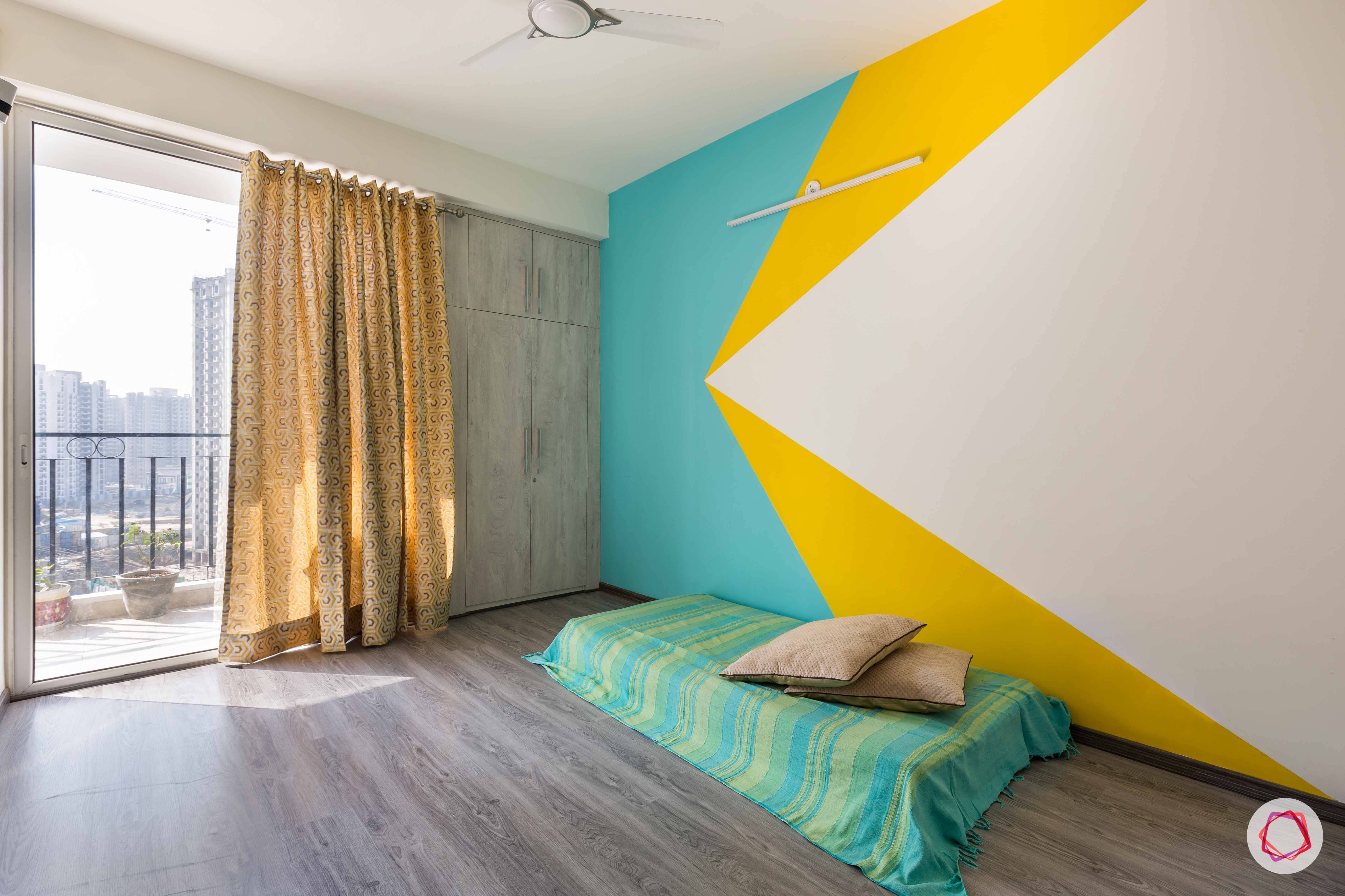 spare-bedroom-colourful-painted-walls-wardrobe-flooring