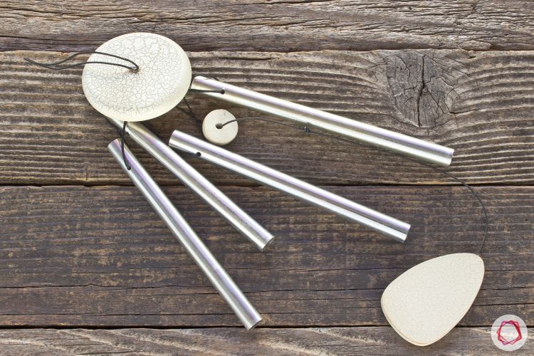 vastu shastra for house_wind chimes_wooden table_steel wind chime