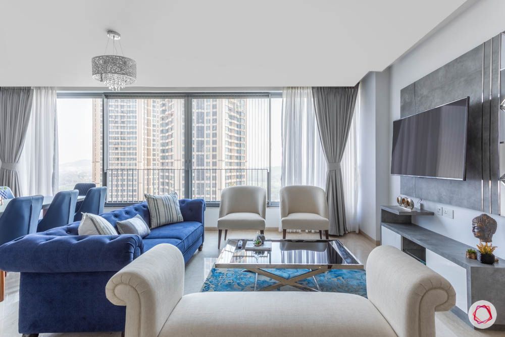 oberoi goregaon-living room-white daybed-blue chesterfield sofa-white chairs