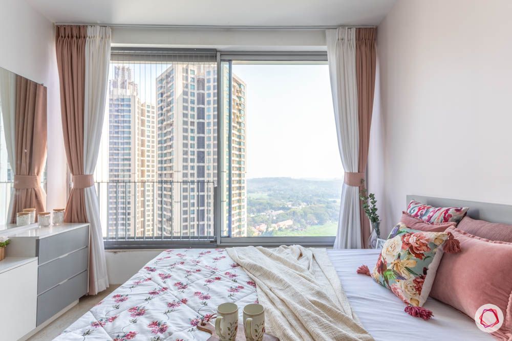 oberoi goregaon-pastel bedroom-big window-dresser