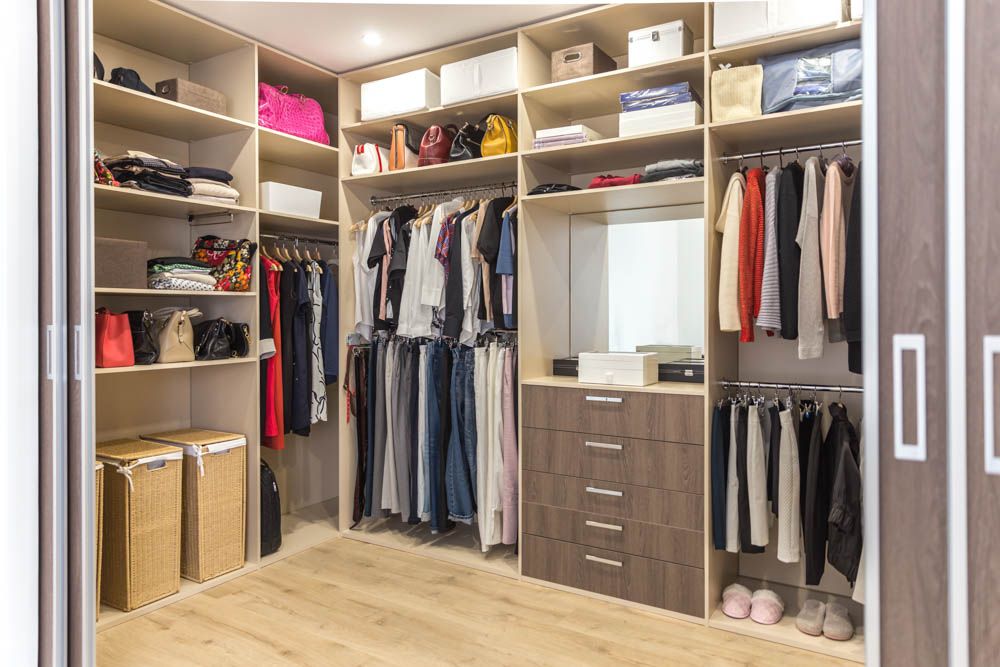 walk-in-wardrobe-shelves-mirror-table-shoes-clothes-wooden-flooring