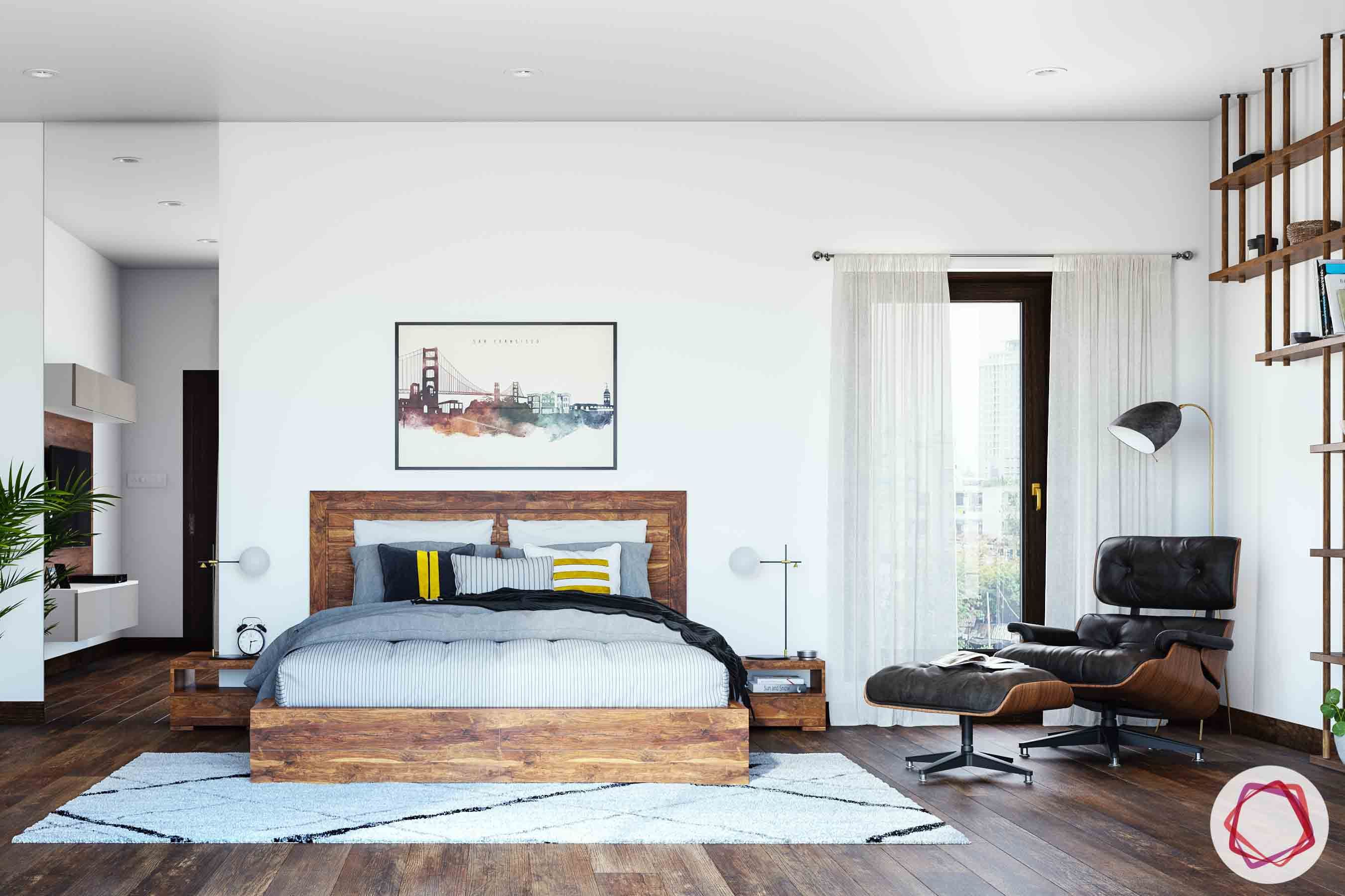 master bedroom-wooden bed-wooden flooring-lounge chair-area rug