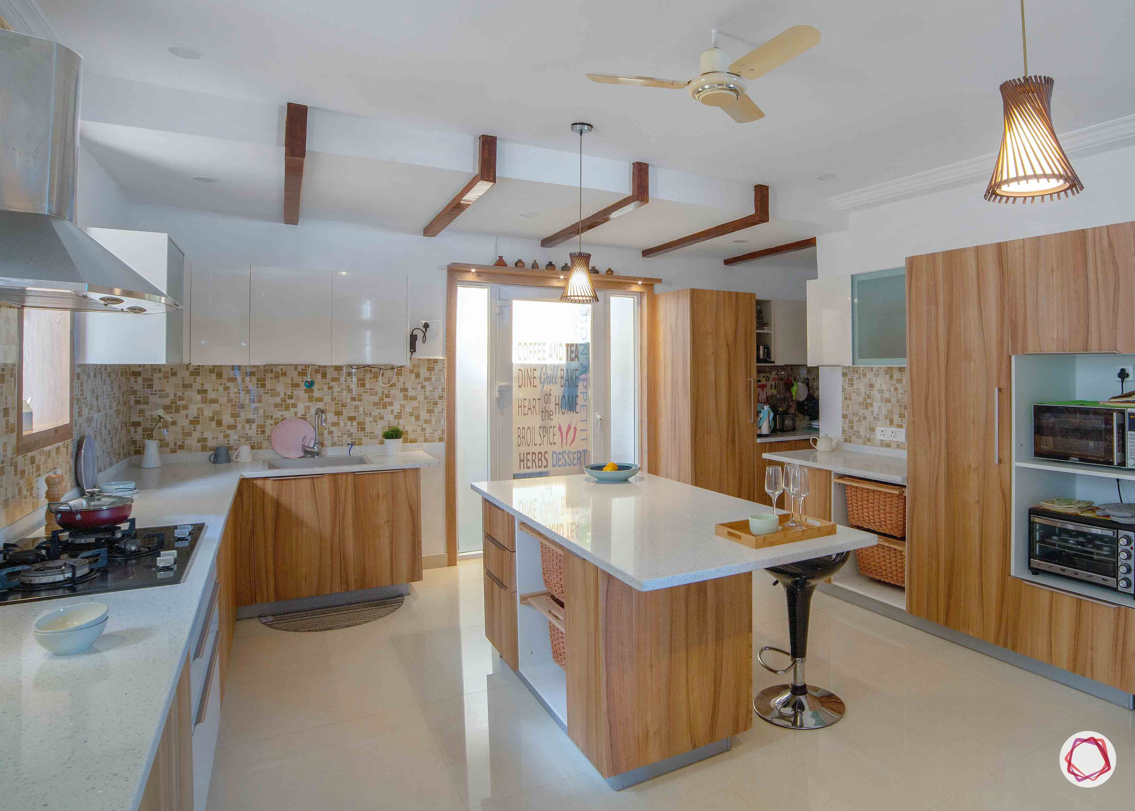 kitchen-brown-white-rafters-lights-wicker-baskets-oven-bar-stool-fan