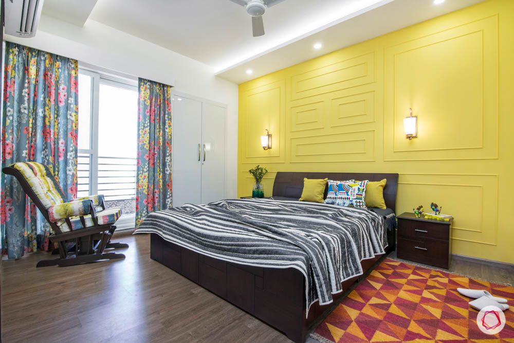 cleo county-guest bedroom-yellow wall-wall trims-area rug