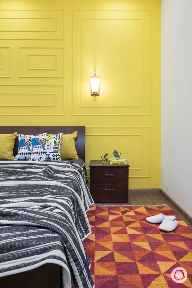 cleo county-guest bedroom-bedside table-yellow wall trims-bright room