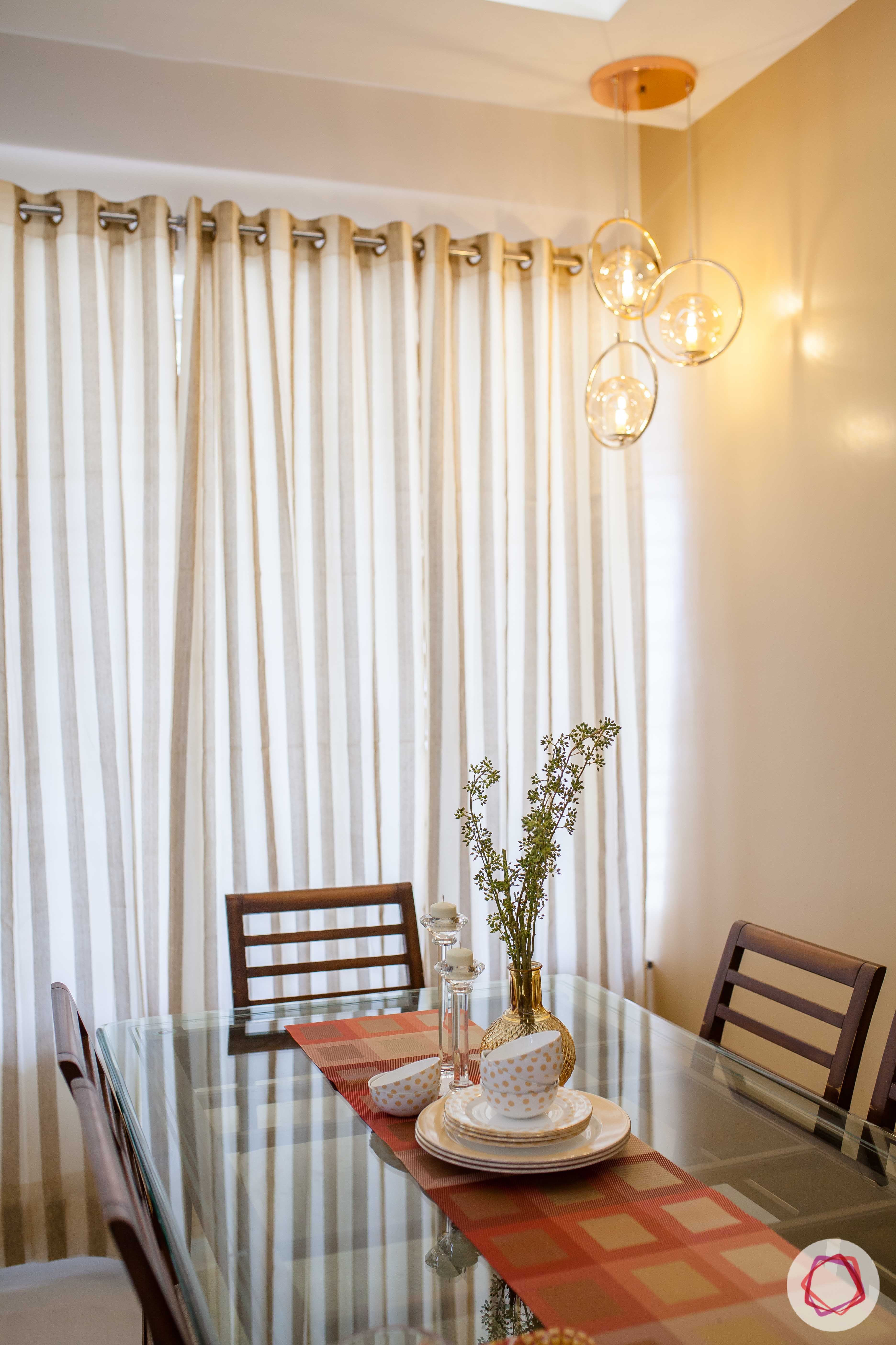 kunal-aspiree-dining-room-corner-lights-glass-top-table