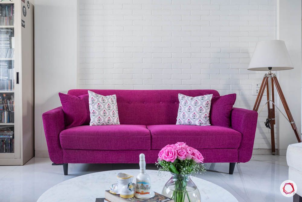 beautiful home images-living room-magenta sofa-tripod lamp-exposed brick wall
