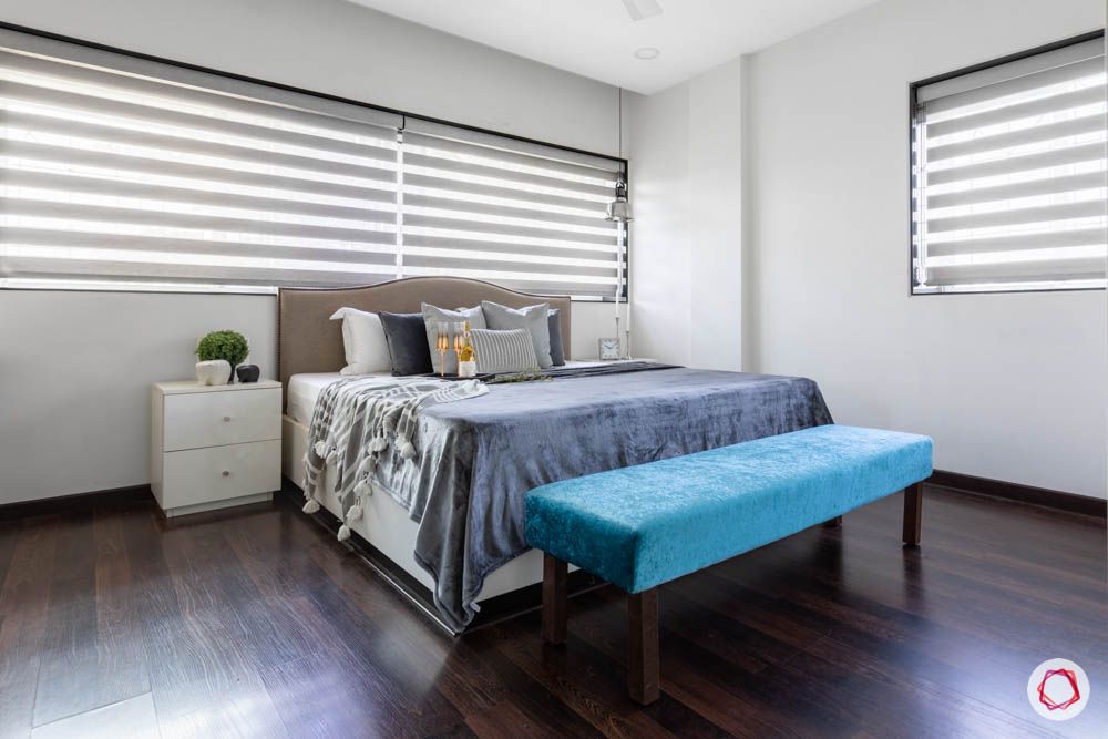 beautiful home images-bedroom-bed bench-wooden flooring-nailhead trim headboard

