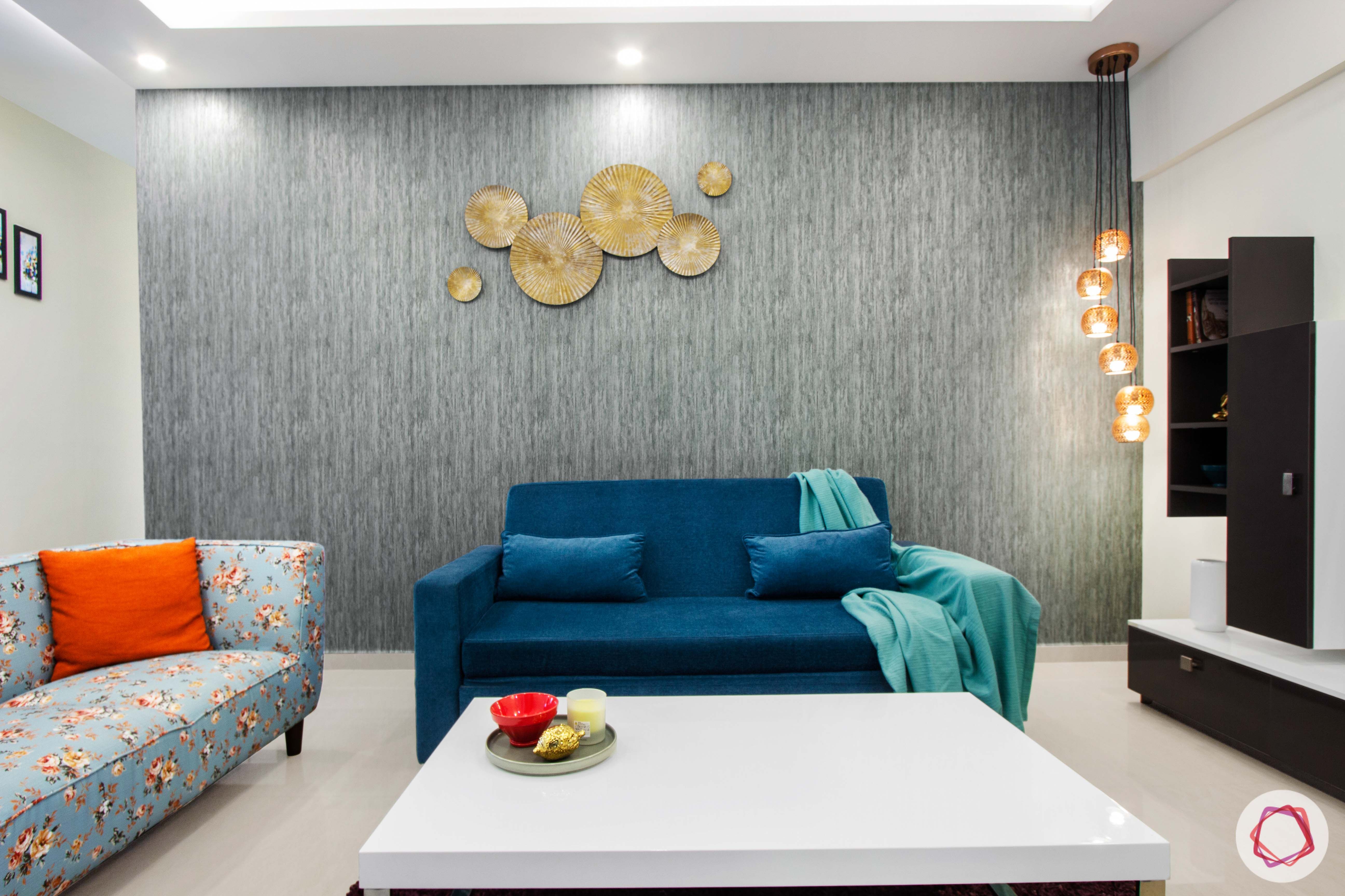 nitesh hyde park-blue sofa-pendant light-orange cushion