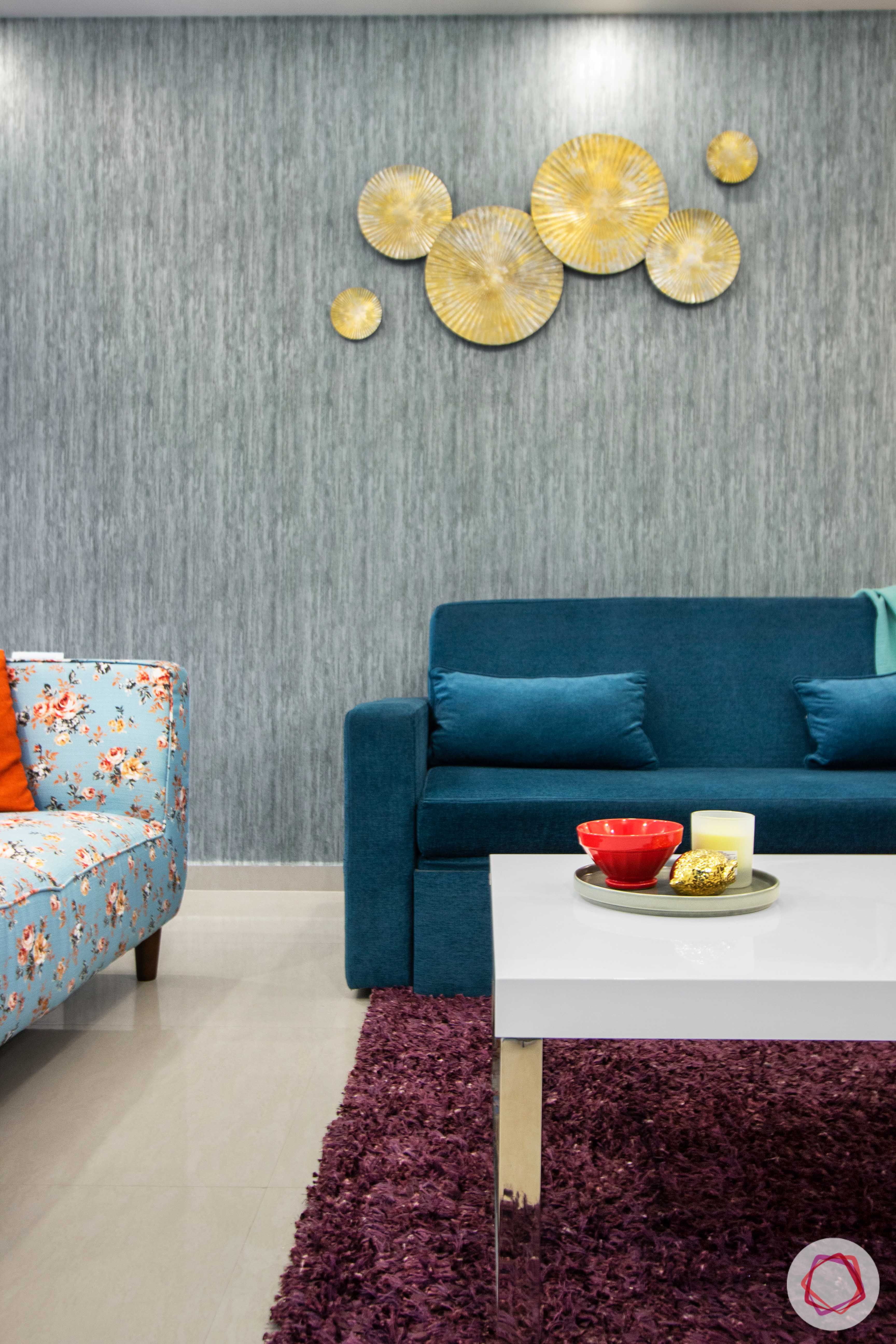 nitesh hyde park-blue sofa-blue wall-gold wall mount