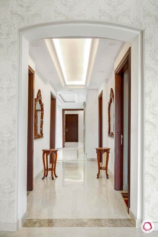 marble-flooring-false-ceiling-wood-table-mirror