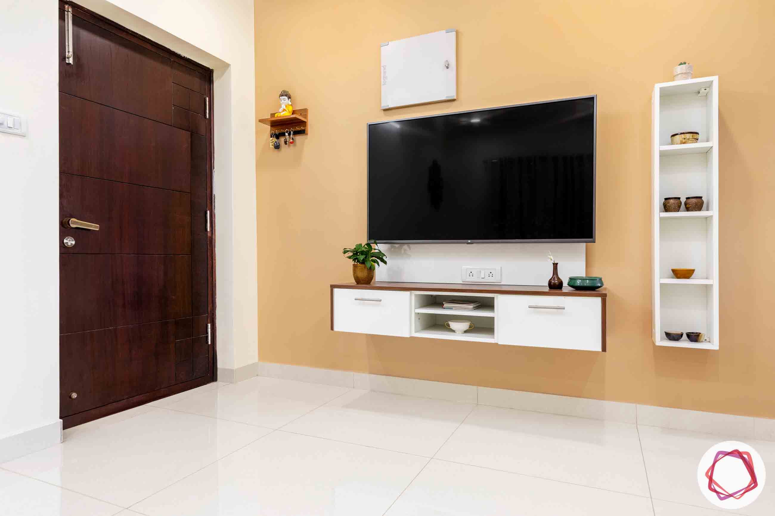 white tv unit designs-peach wall colour