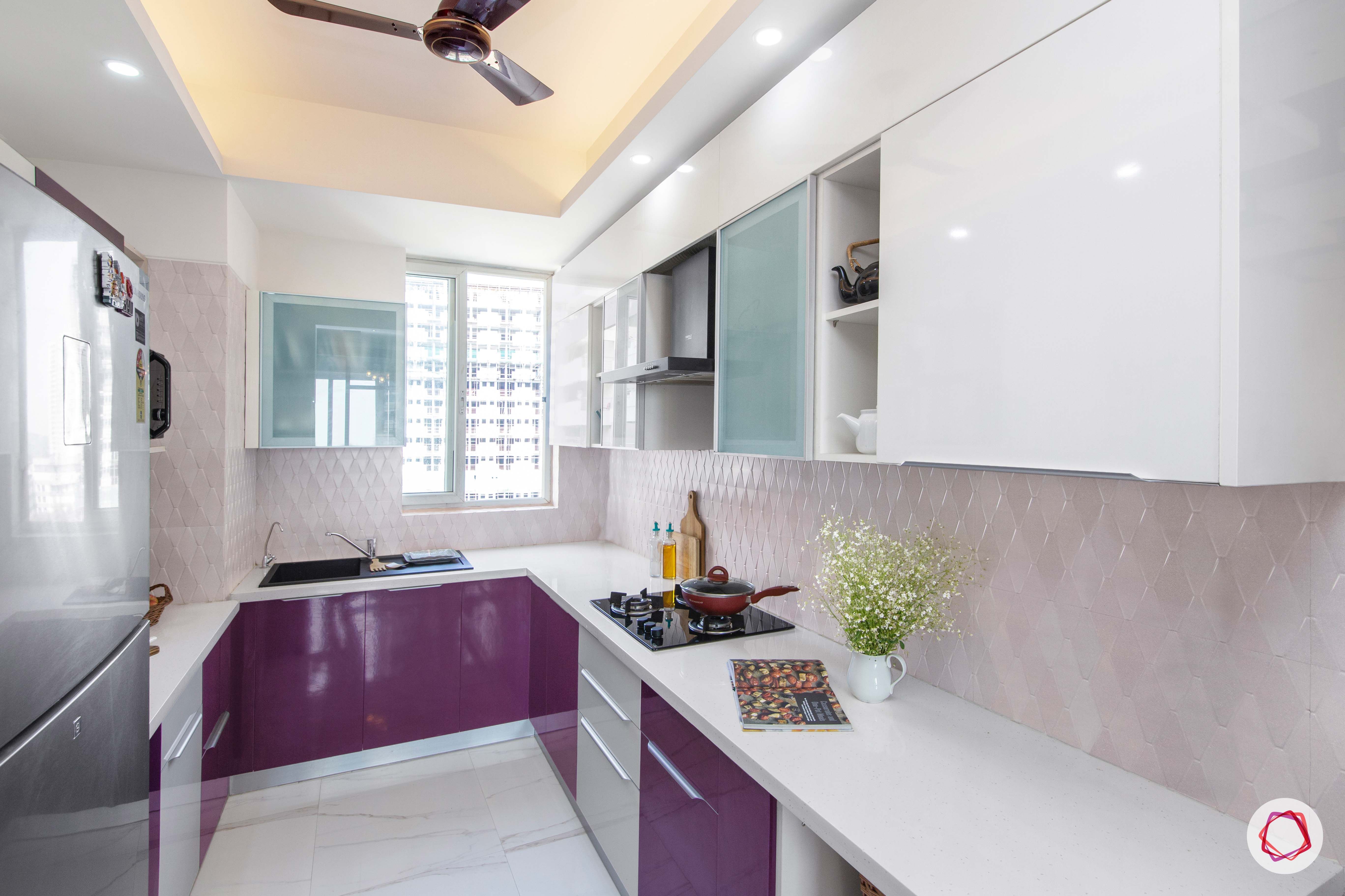 how to make a kitchen look brighter-recessed lights-purple cabinets-white cabinets