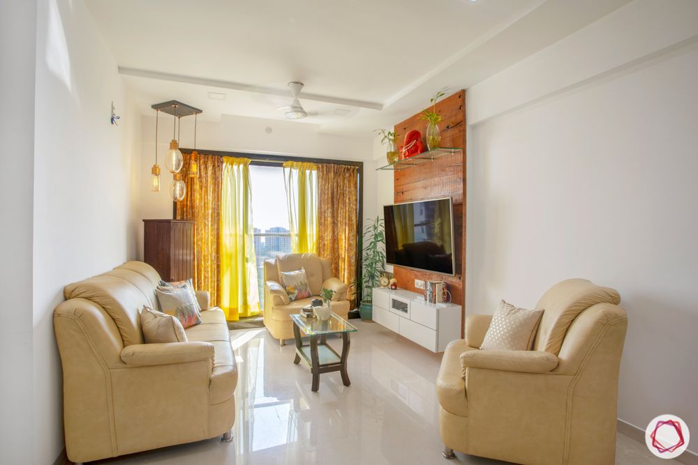 2-bhk-in-mumbai-living room-marble floor-curtains-centre table