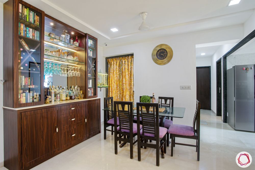2-bhk-in-mumbai-dining room-wooden-dining-chairs-glass-top-table
