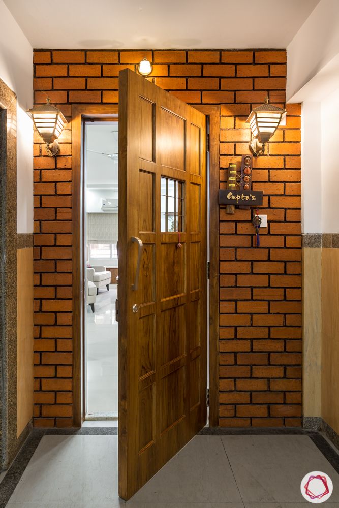 ajmera-exposed brick wall designs-front door designs