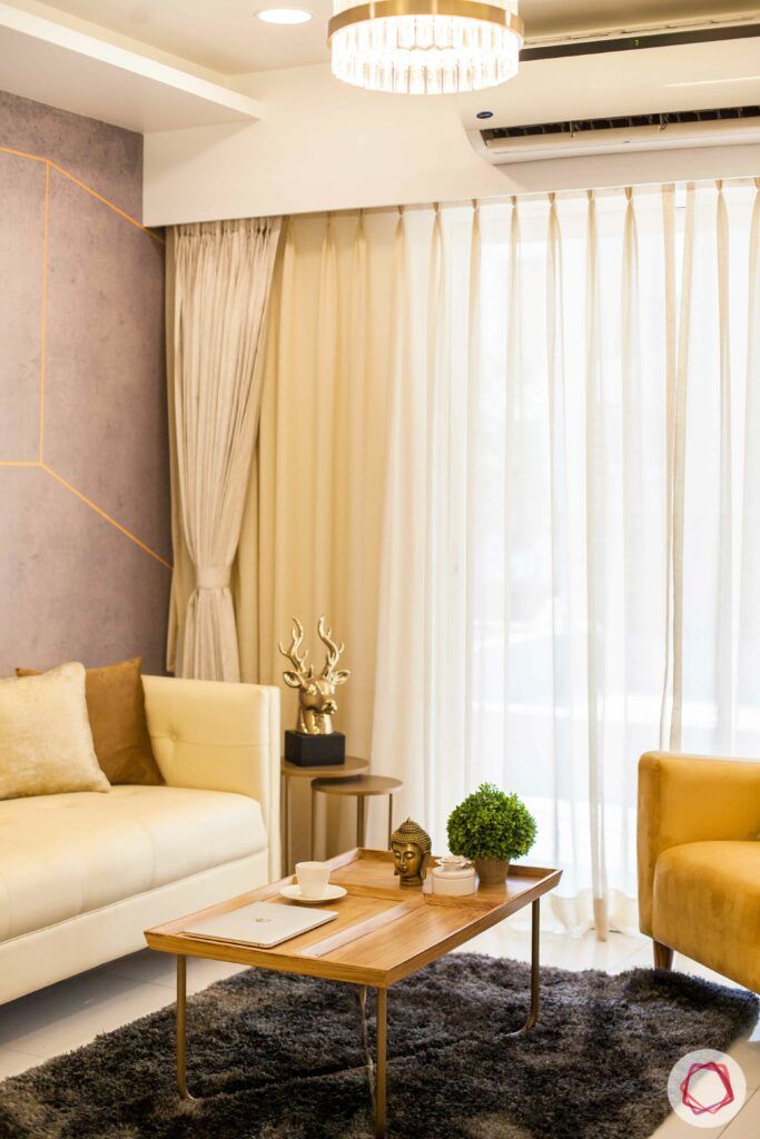 2bhk pune-brown rug-chandelier