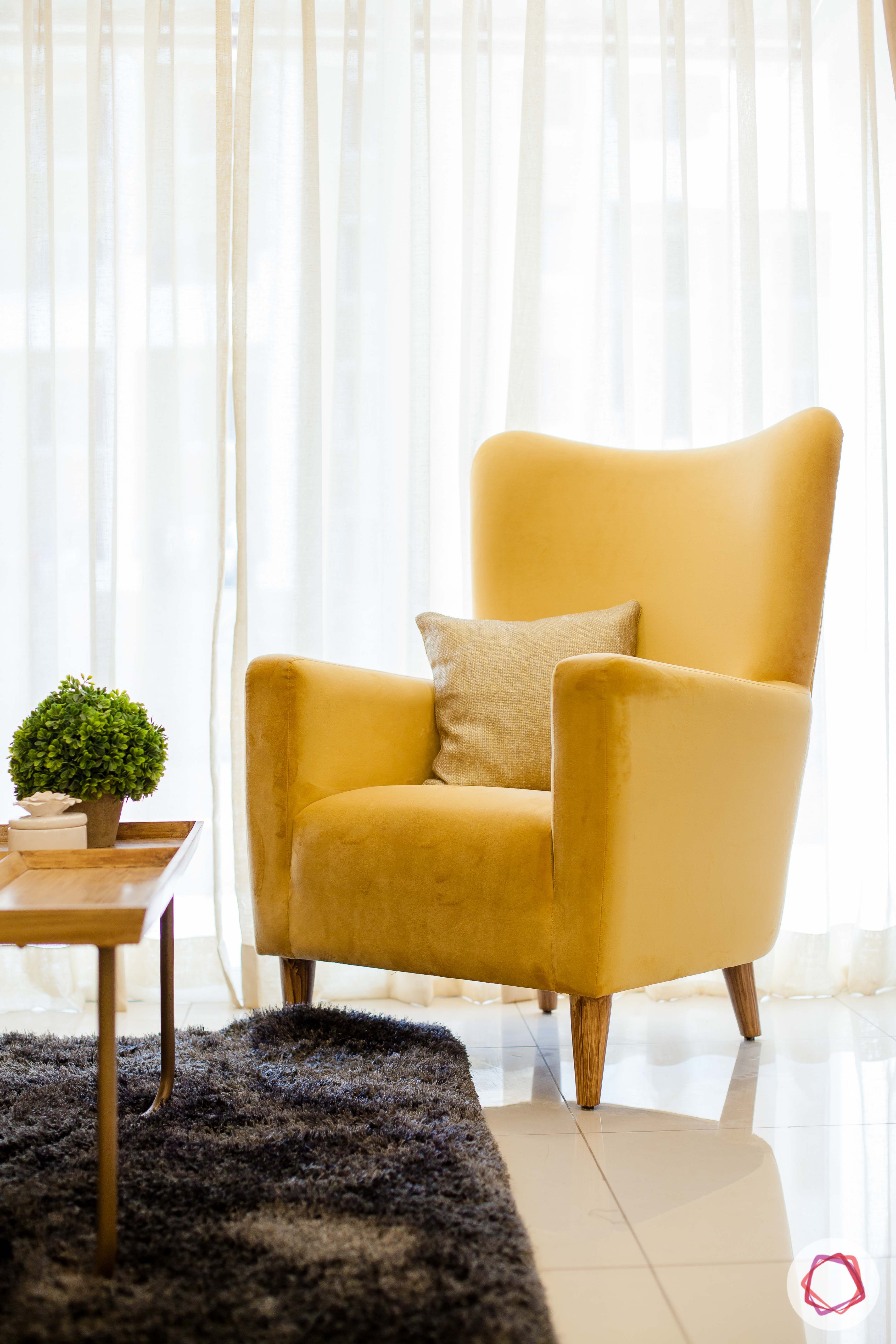 2bhk pune-yellow accent chair-indoor plant
