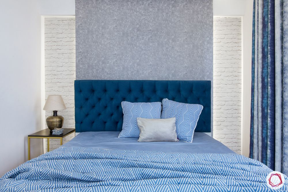 bedroom-white brick wallpaper-blue headboard
