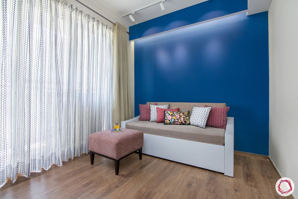lounge-sofa bed-cushions-blue accent wall
