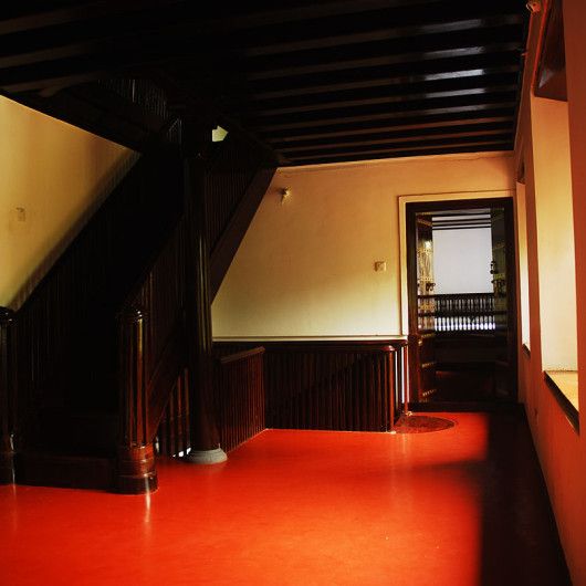 red oxide flooring-wooden staircase
