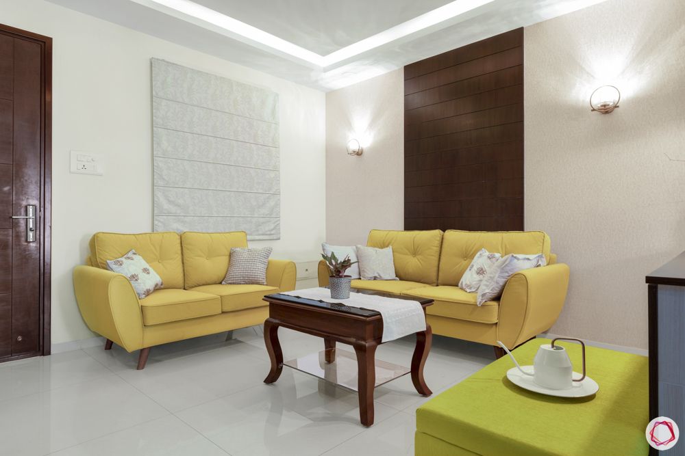 rajapushpa atria-yellow sofa designs-wooden panel designs