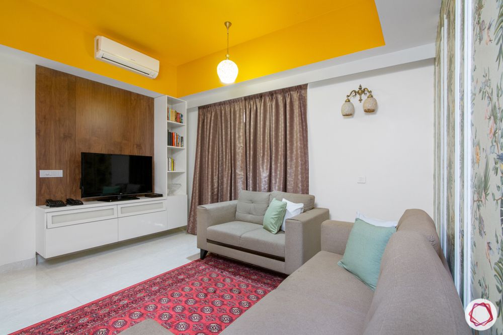 tv unit-white unit designs-yellow ceiling