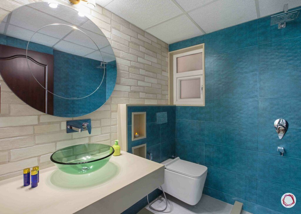 bathroom storage ideas-blue walls-round mirror