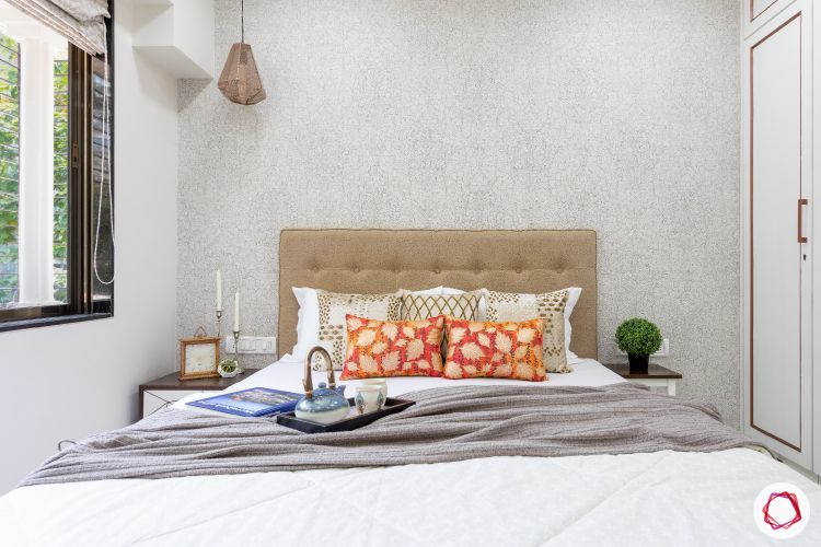 interior design company in mumbai-silver wallpaper-golden headboard-master bedroom-pendant light