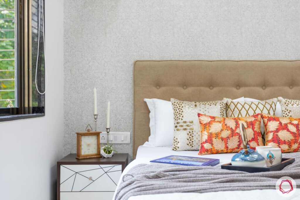 interior design company in mumbai-golden headboard-silver wallpaper-master bedroom