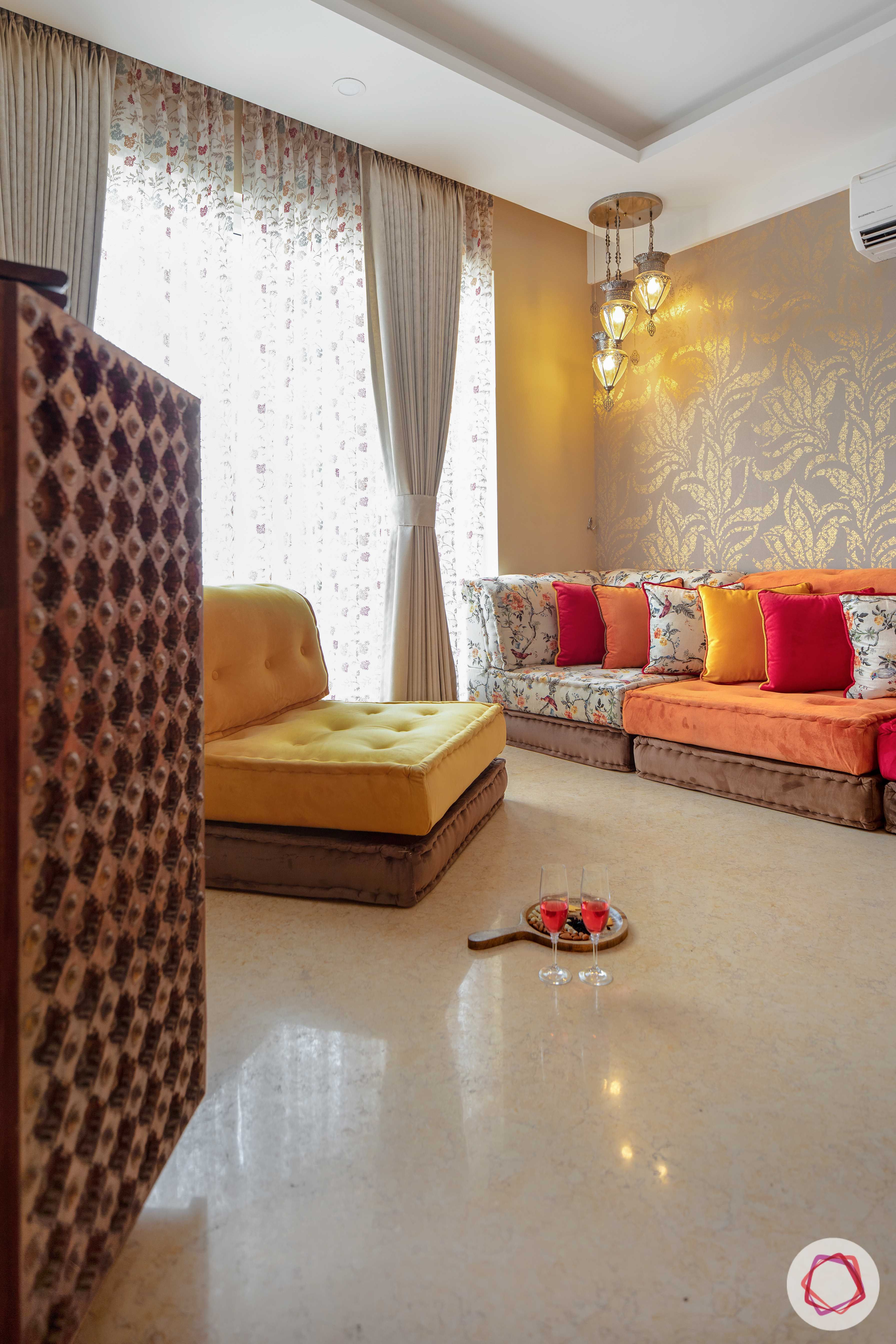 bookshelf-orange-yellow-seating-pendant lights