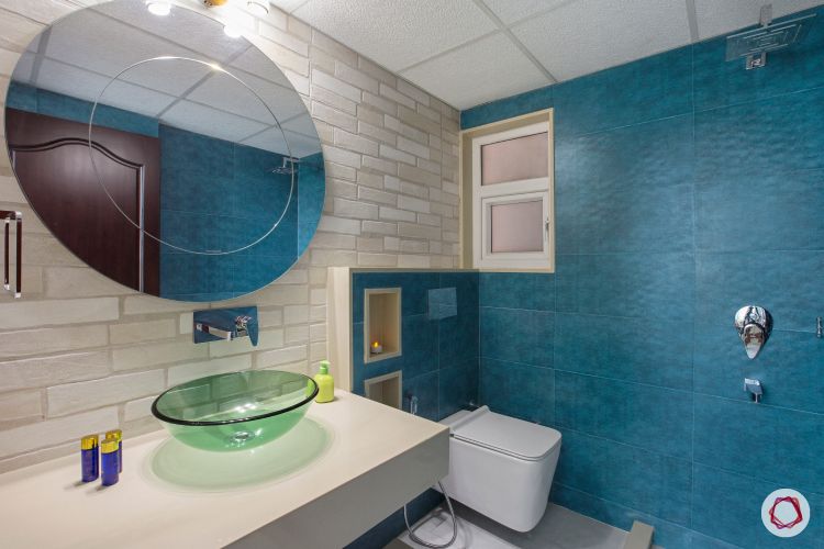 bathroom-blue-wall-circle-mirror-glass-sink-white-sink