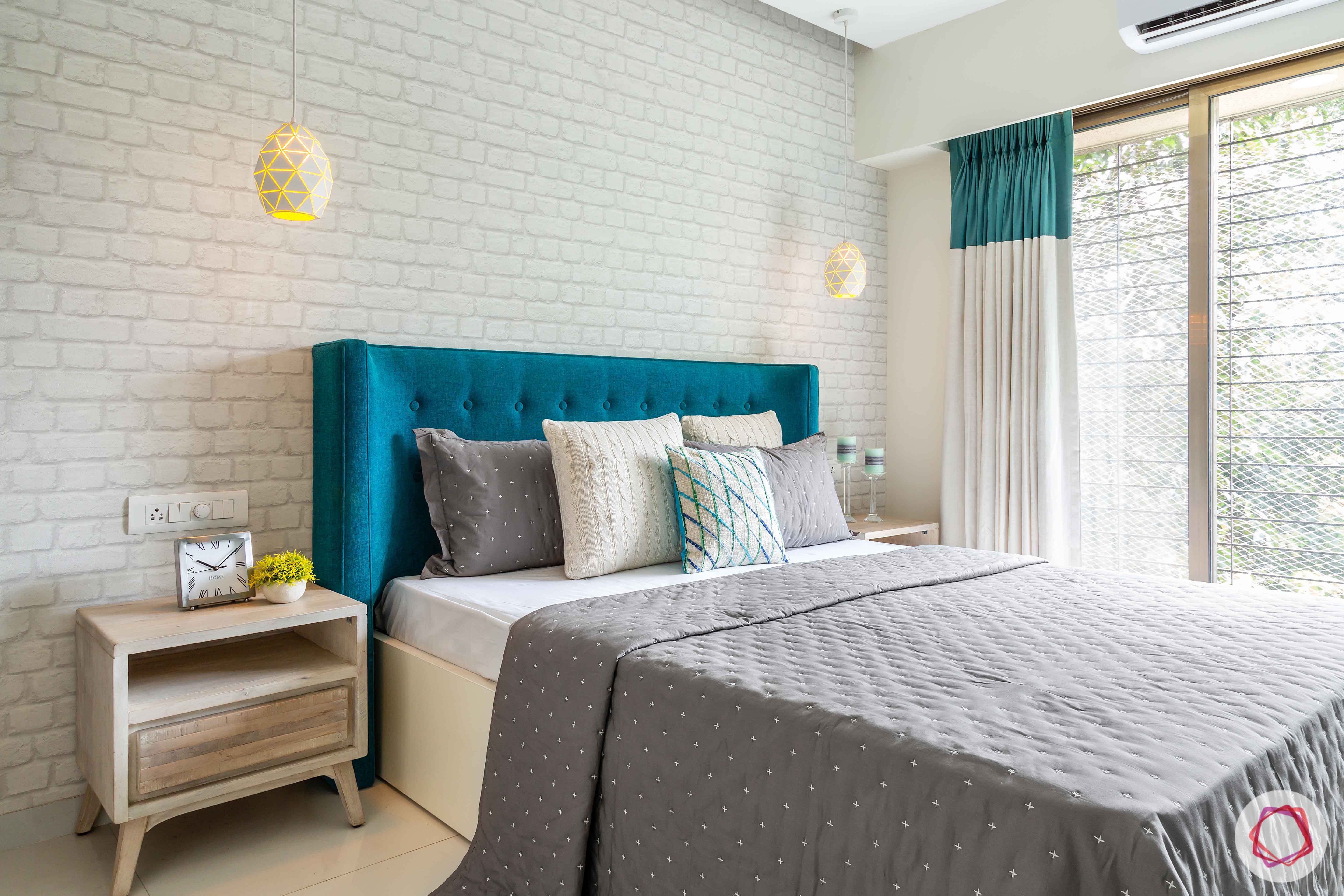 modern bedroom design-exposed brick wall-aqua headboard-side table-pendant lights