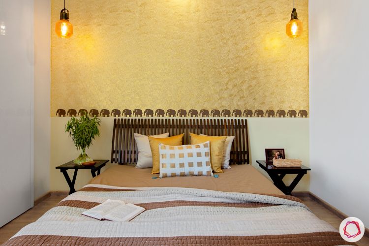 modern bedroom designs-wallpaper accent wall-yellow accent wall-wooden furniture-elephant motifs