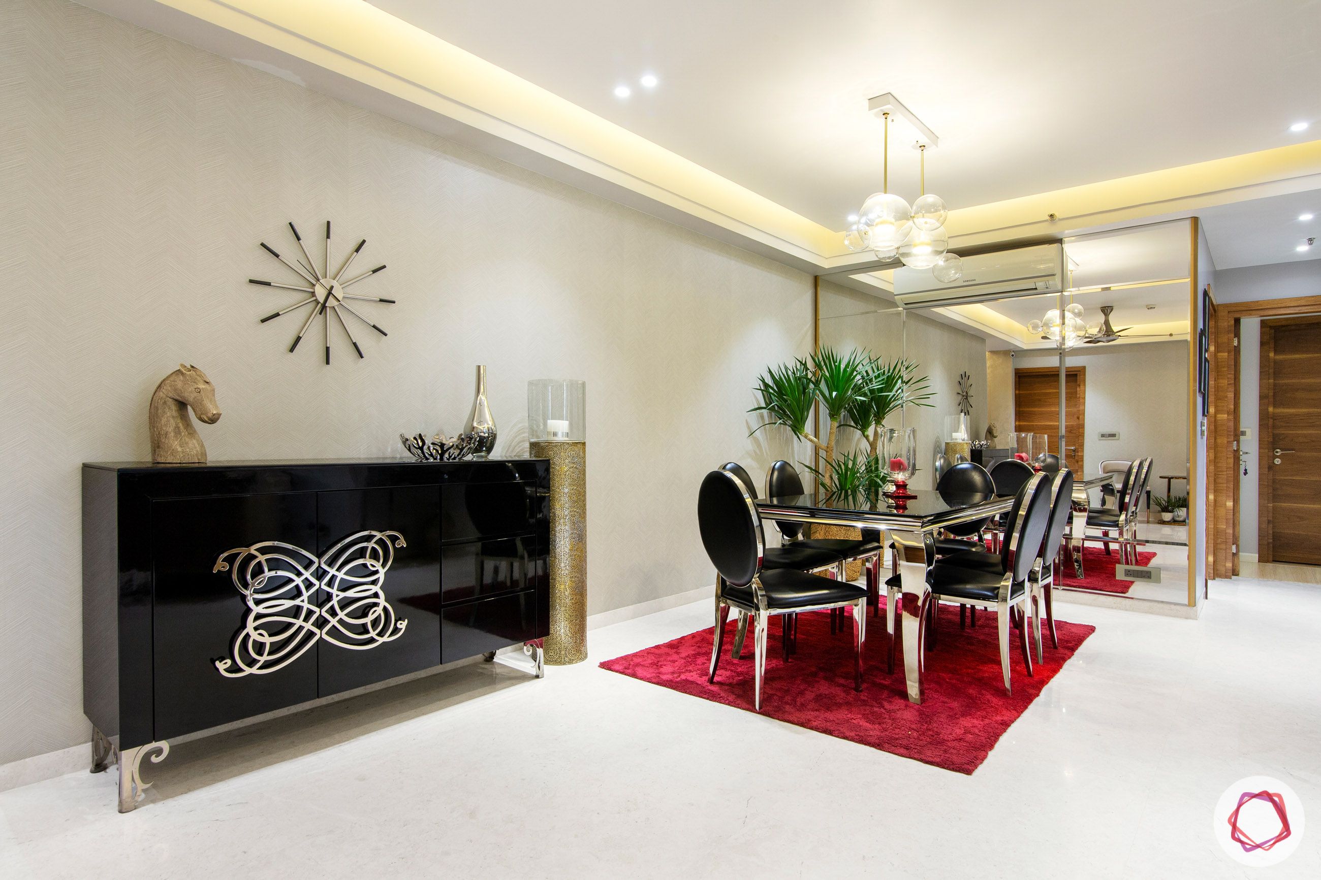 dlf park place-dining room-velvet carpet-cabinet-chandelier-mirror panelling