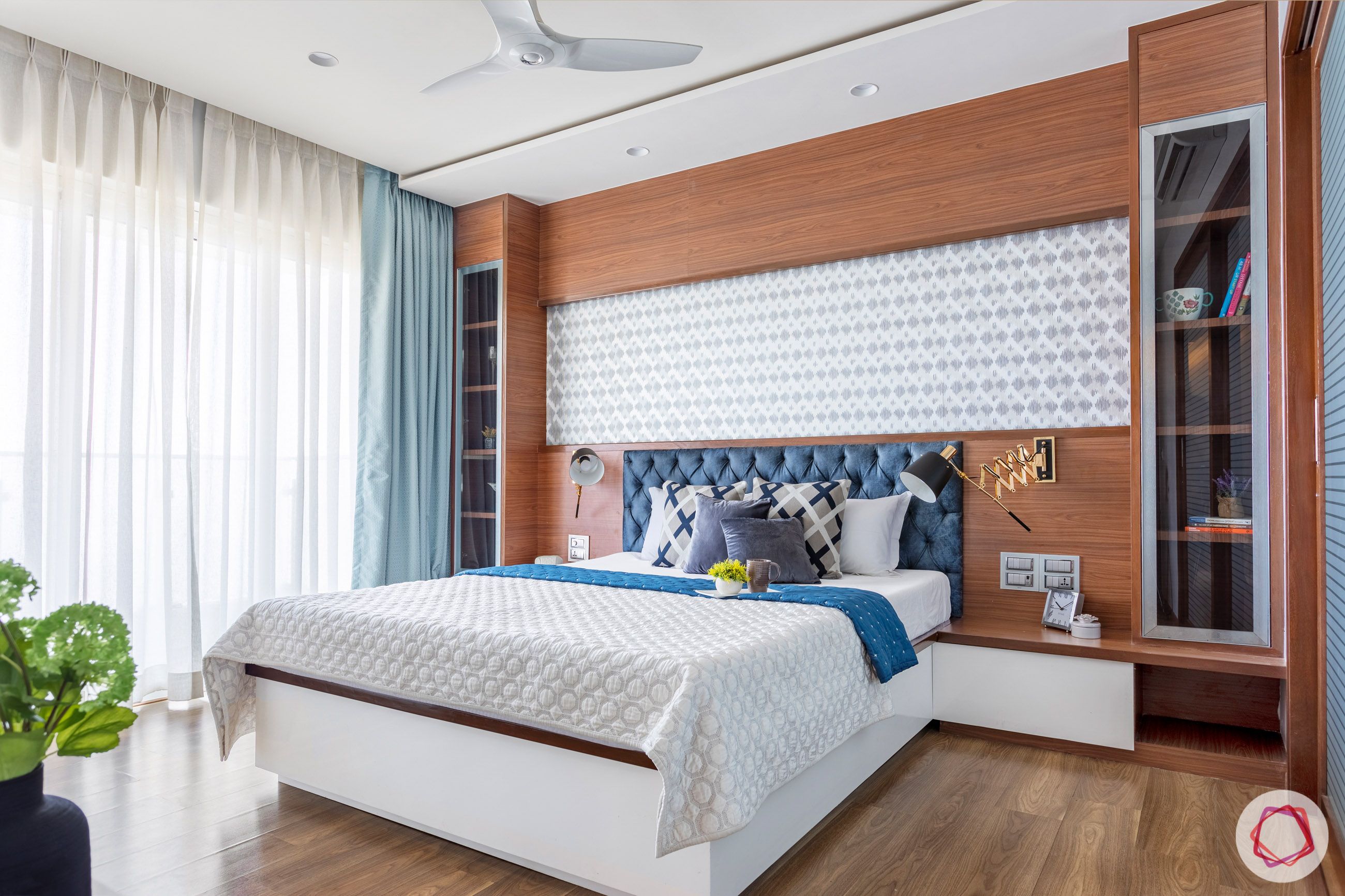 bedroom-blue-headboard-wallpaper-cabinet-wooden-floor