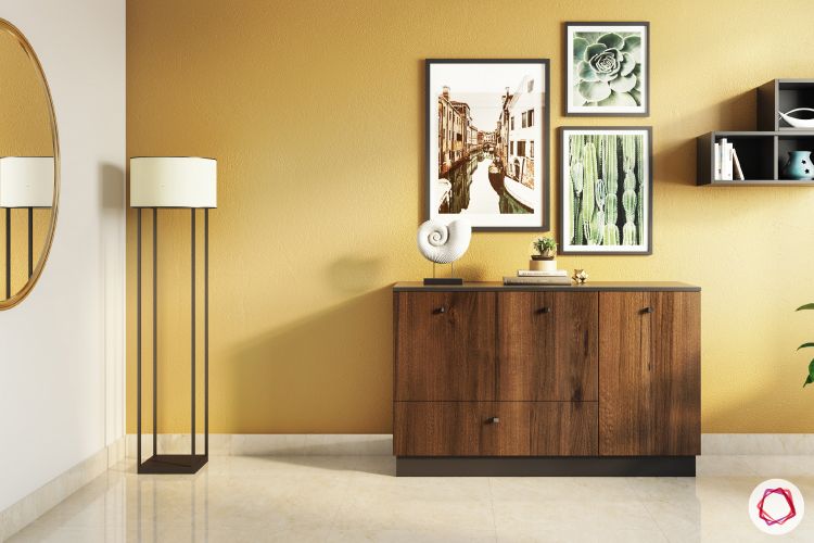 foyer-lighting-yellow-wall-white-lamp-painting-storage-cabinet