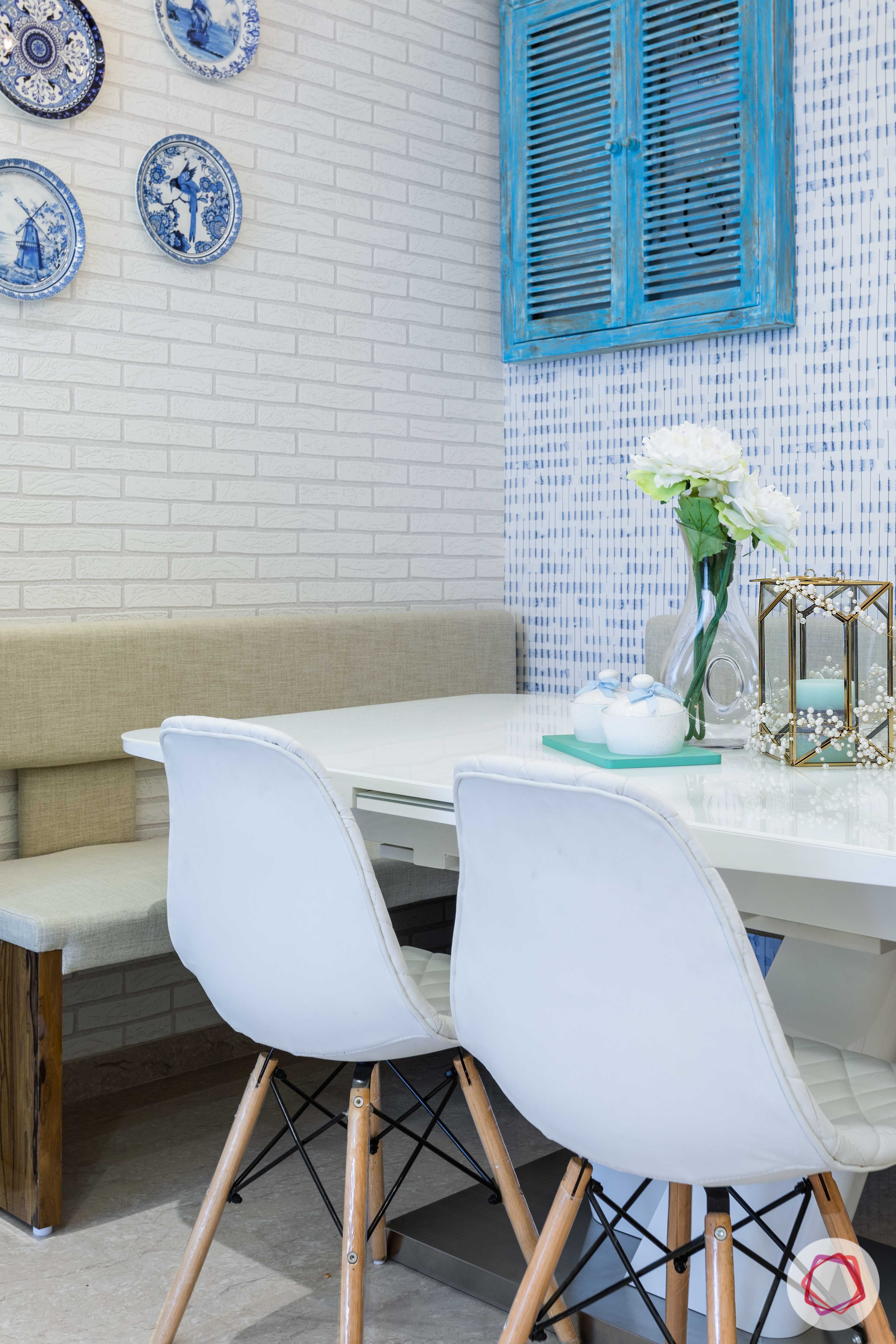 jp decks-dining table-white chairs-blue window-turkish plates