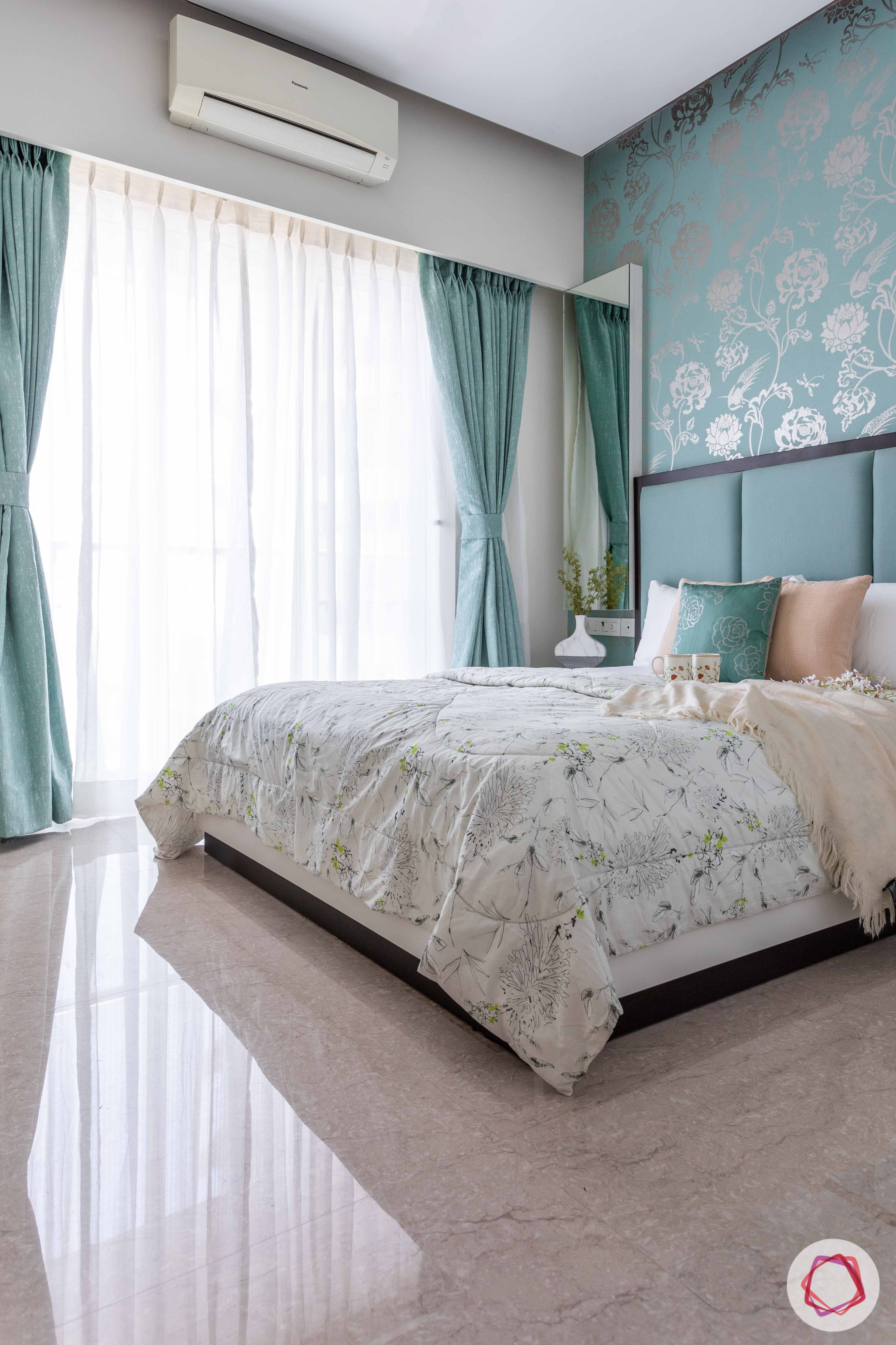 green bed-green and silver wallpaper-green curtains