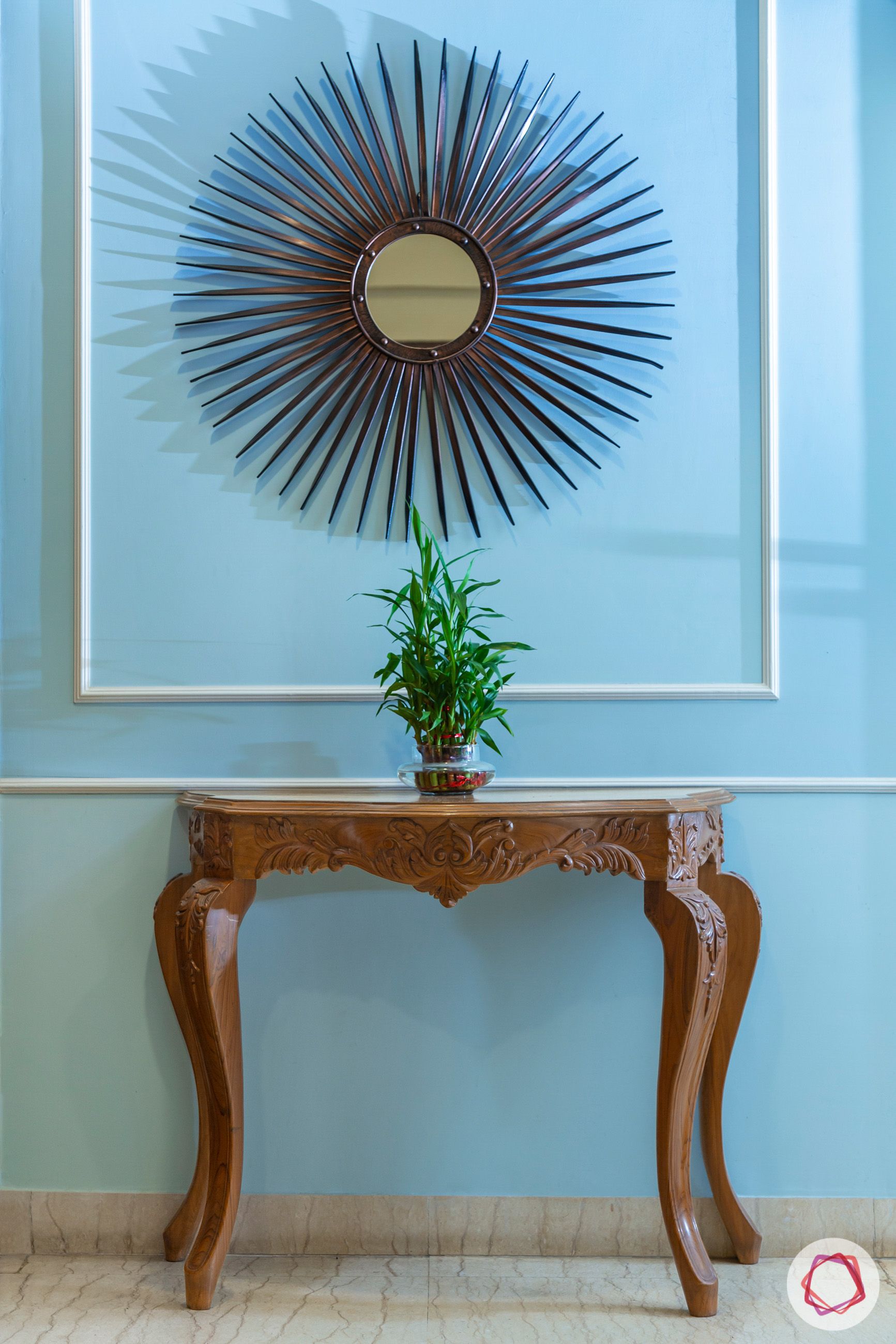 house in gurgaon-blue wall ideas-wooden console table-mirror designs