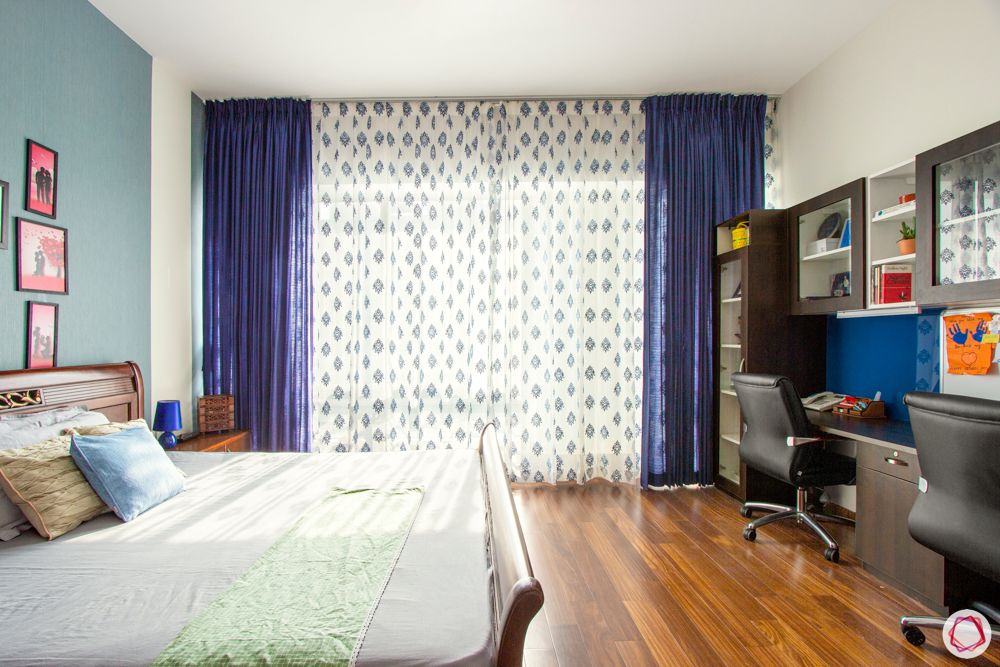 guest-bedroom-study-blue-curtains-wooden-floor