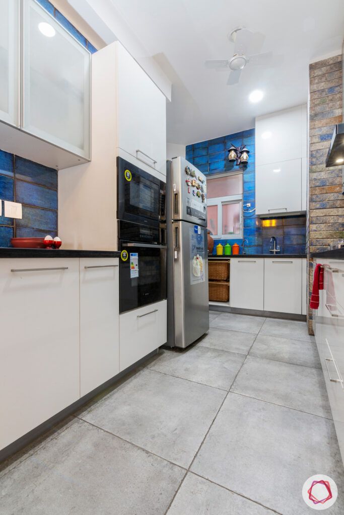 grey flooring-blue tiles-white kitchen cabinets-two tones tiles
