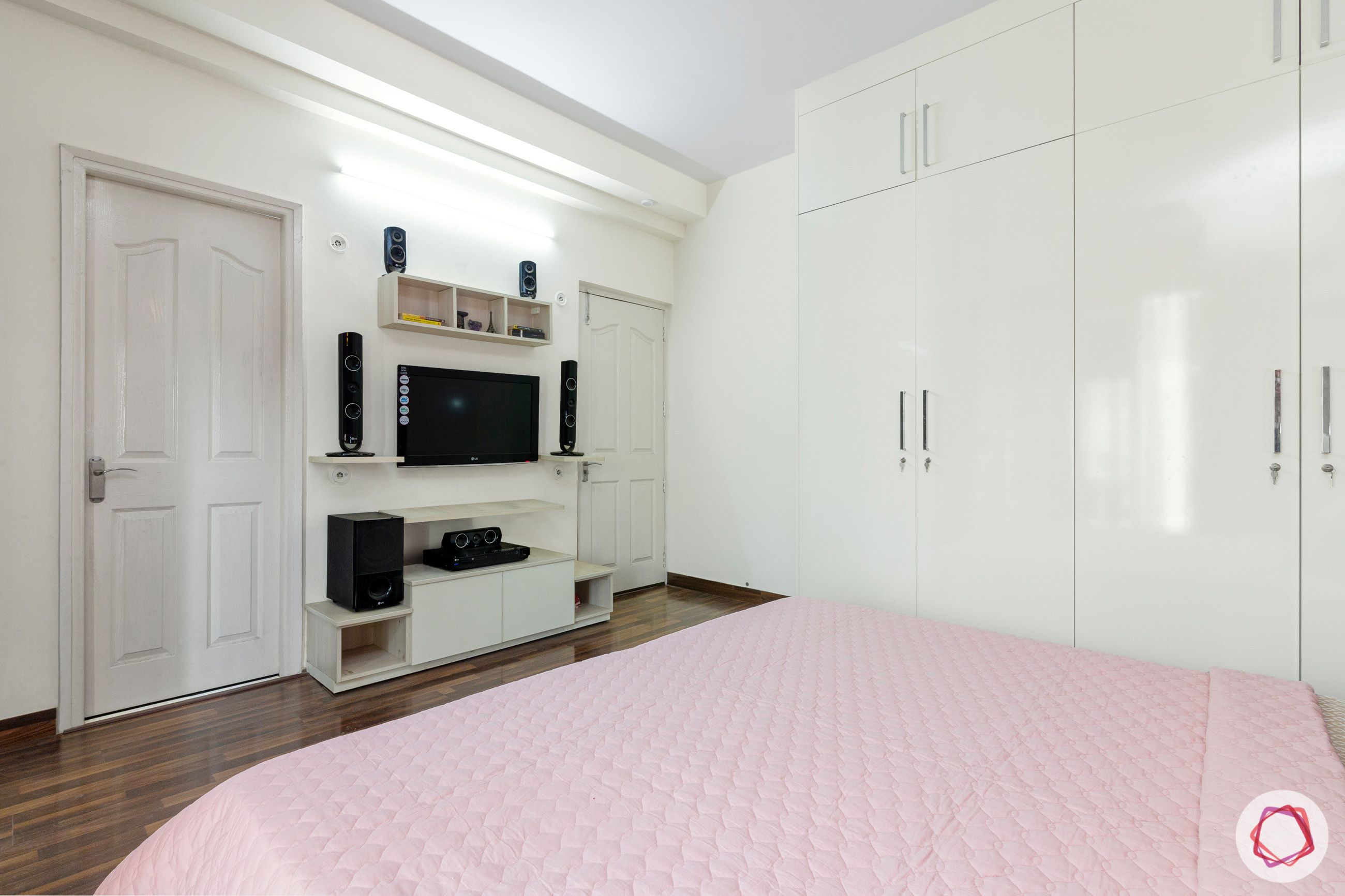 mapsko royale ville-white tv unit-white wardrobes- Champagne white wardrobes-wooden flooring