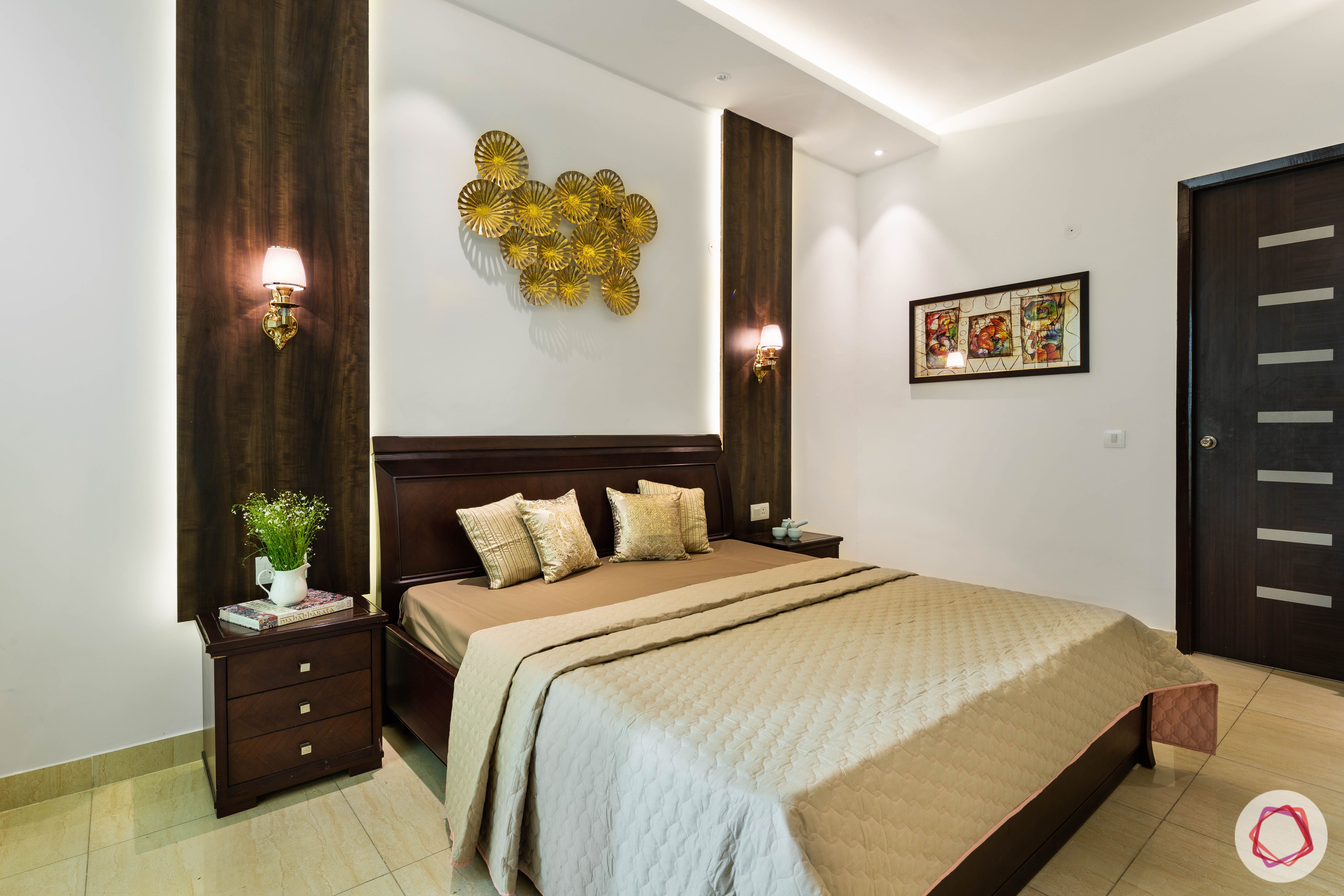 wooden panels-dark wood bed-white walls-cream walls-golden wall art