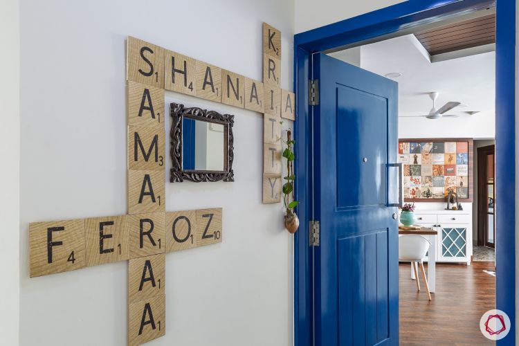 door-colours-blue-glossy-nameplate-mirror-plants-wooden-flooring