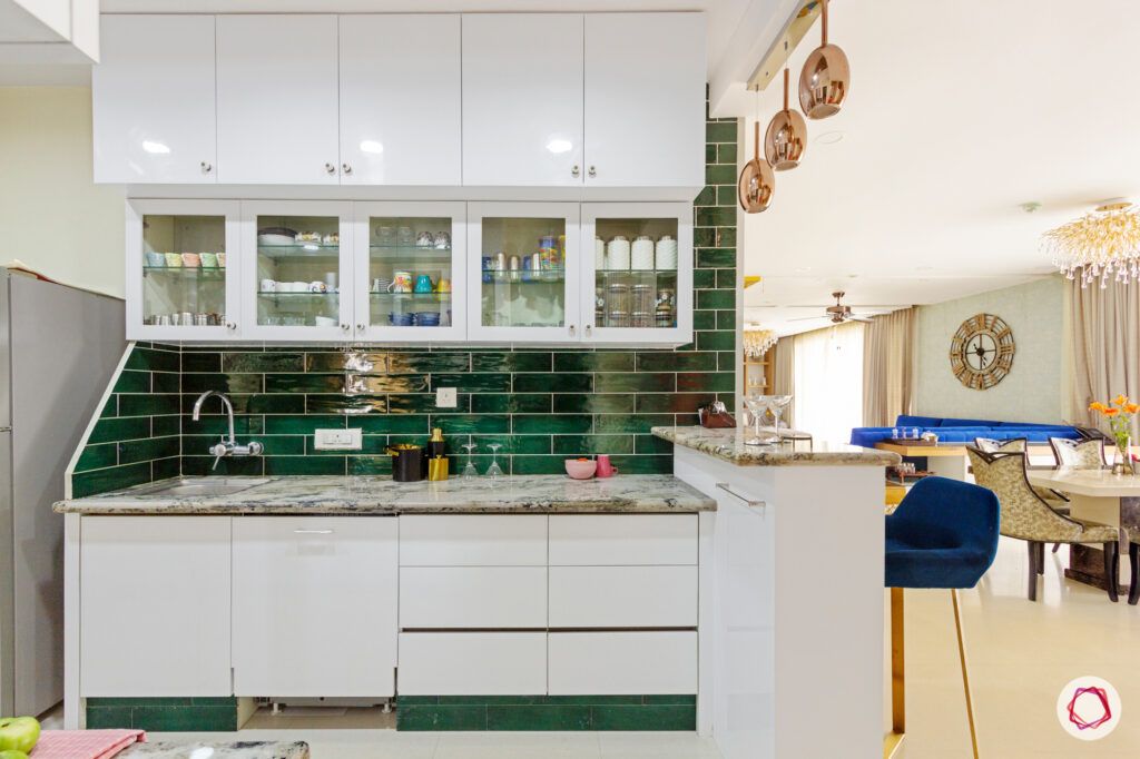 hiranandani bangalore-green kitchen tiles-white kitchen cabinets